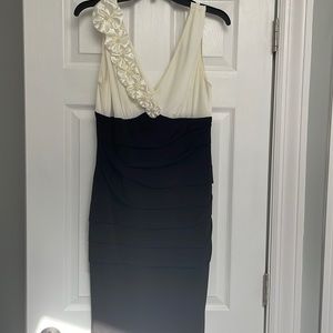 Black and white formal dress with flower detail by Connected Apparel